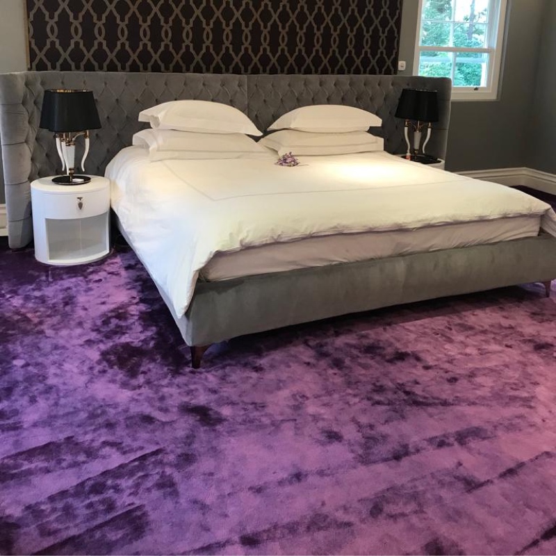 Bedroom with custom purple carpet
